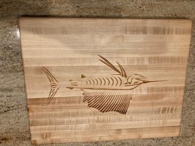 Engraved Sailfish On A Curly Maple Board